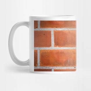 Red brick background clloseup pattern with white grout lines. Mug